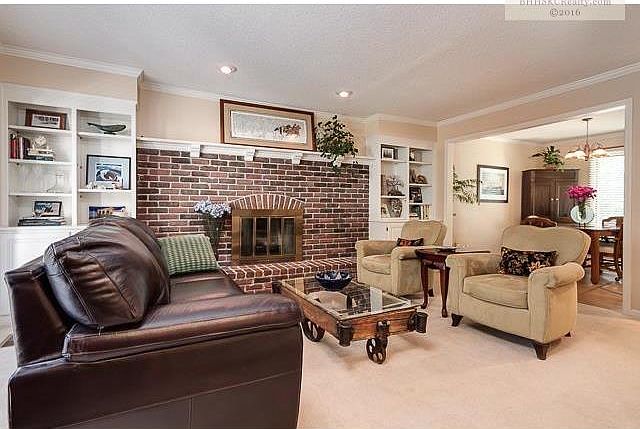 Living room with fireplace and built-ins