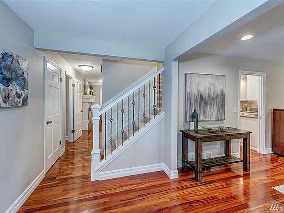 Step in the front door onto gleaming koa wood floors.