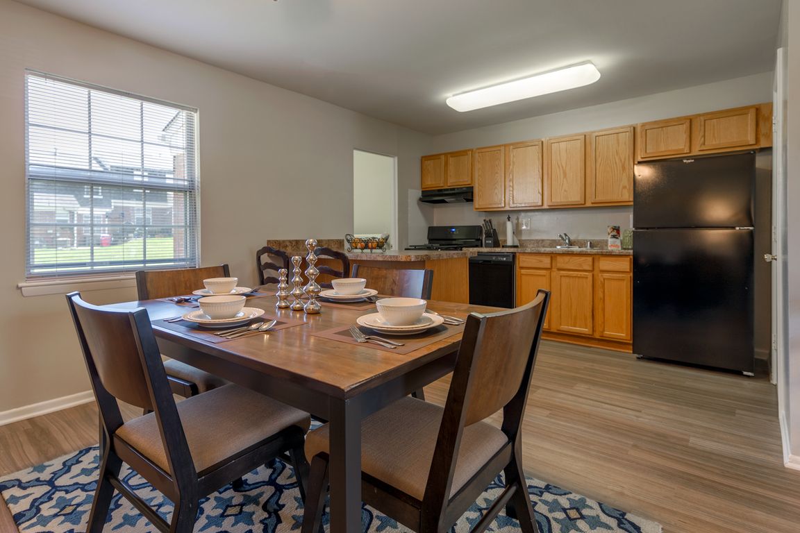 Solid Wood Cabinets & Black Appliances