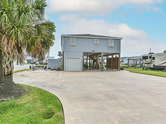 To the left of this home you will find parking and hookups for 2 RVs.