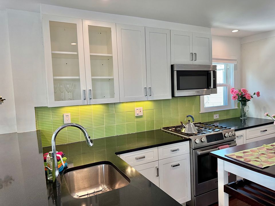Stunning backsplash and microwave.
