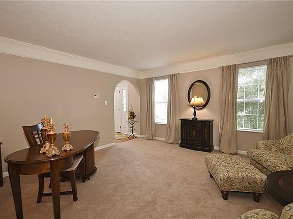 We love the beautiful & soft wall color, natural light from the windows, and great crown molding feature.