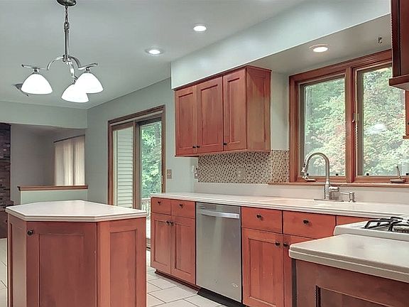 Spacious kitchen with gas range and casual dining area