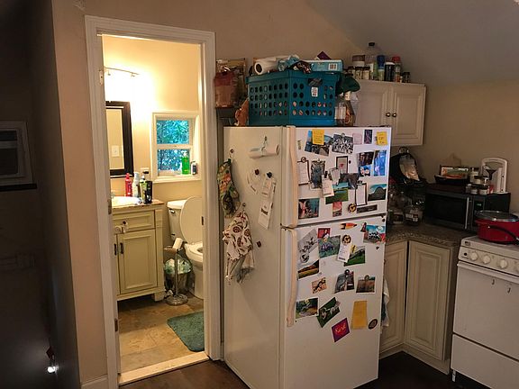 View of kitchen & bathroom, entryway on left