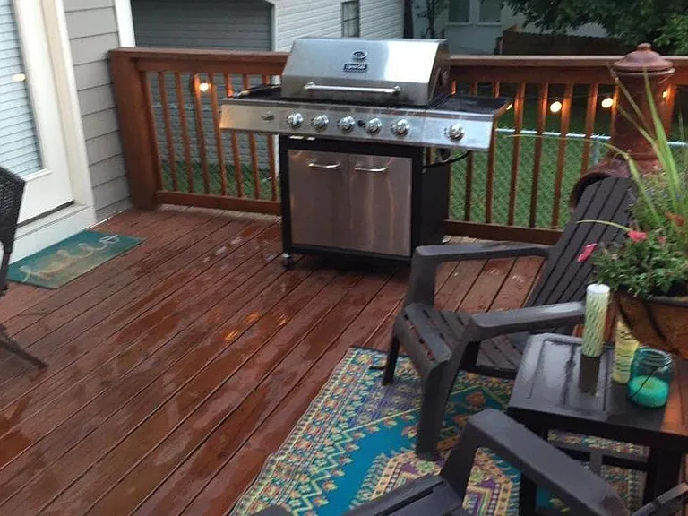 Large back deck with chimenea and string lights