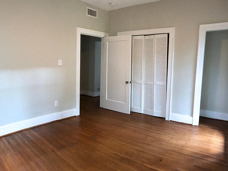 Third bedroom with closets and natural light on two sides