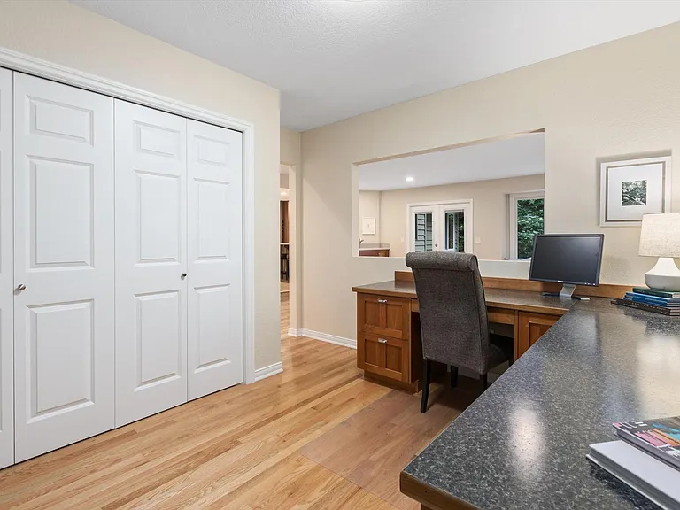 This room has been enclosed, desks removed, and is a fully enclosed and private bedroom now