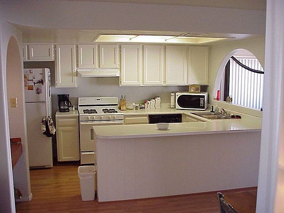 Plenty of counter space and cabinets, plus breakfast nook (to right of pic)