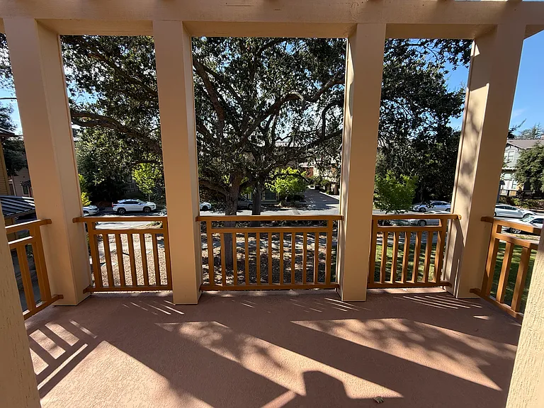 Primary bedroom has a patio door that opens a balcony overlooking the community green belt.