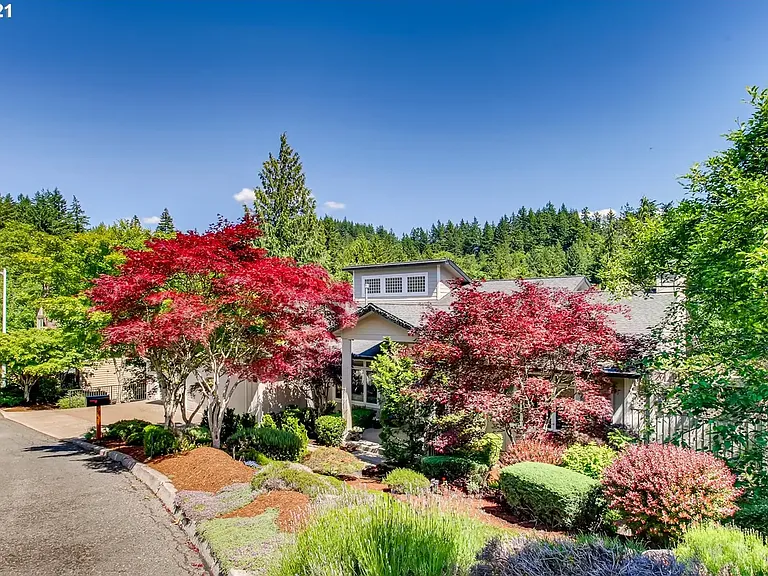 Beautifully designed landscaping that enhances the home's curb appeal and natural surroundings.