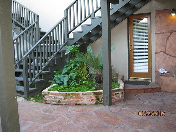 Interior courtyard, stairs to the right go to Unit B