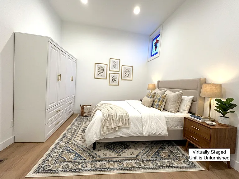 Bedroom 2 with stained glass accent window (virtually staged)