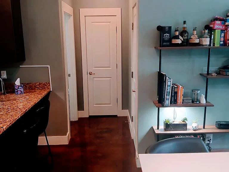 View towards guest/full bath. Full bath to left. Linen closet - straightforward and coat closet to right. Lots of storage