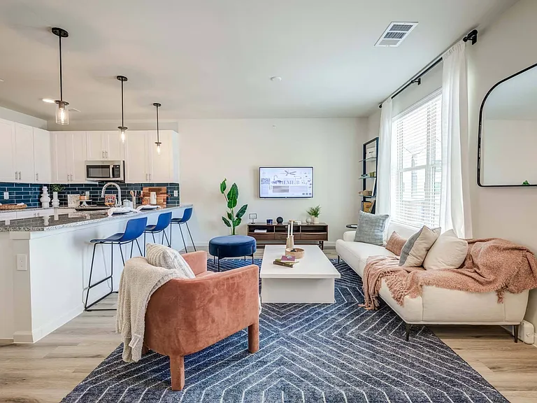 The open-concept layout seamlessly connects your living and dining spaces, perfect for entertaining.