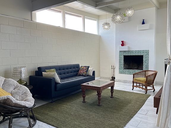 Leather queen sized sleeper sofa. High ceilings on the east side. Functioning fireplace.