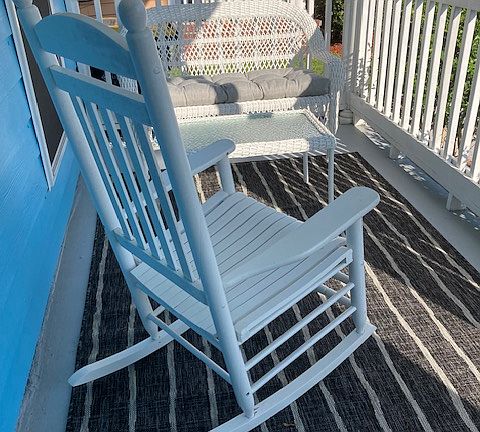 Porch furniture and decor included!