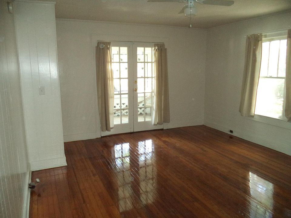 Beautiful hardwood floors, French doors open to covered porc