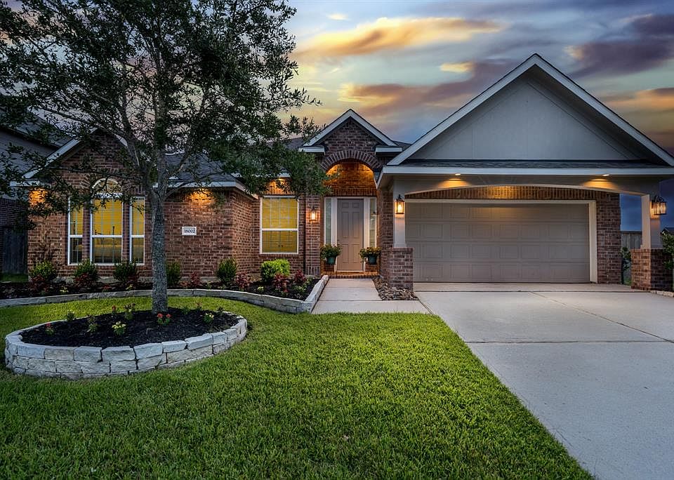 Welcome to 18002 Fossilwood Lane, a one story home in Oakcrest North.