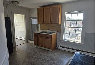 Another kitchen view. Pantry off to the right by the refrigerator. Access to back porch is to the left of the sink.