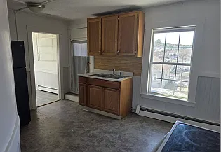 Another kitchen view. Pantry off to the right by the refrigerator. Access to back porch is to the left of the sink.
