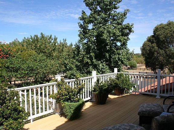 Huge balcony spans one side of home, great views!