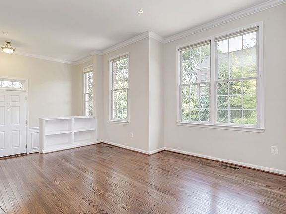 Main level features gleaming hardwoods and elevated ceilings