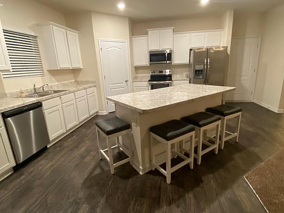 Kitchen with island and stools