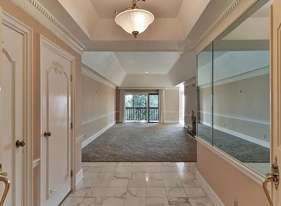 Welcome to this outstanding penthouse condominium with soaring tray ceilings, marble floors, custom molding & panoramic views of the golf course.