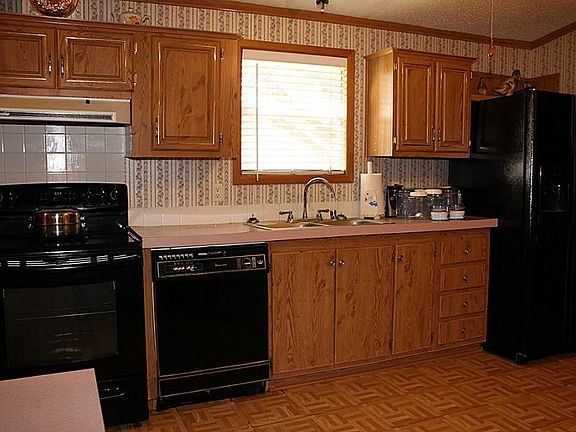 Kitchen Features Natural Lights and an Abundance of Cabinet Space.