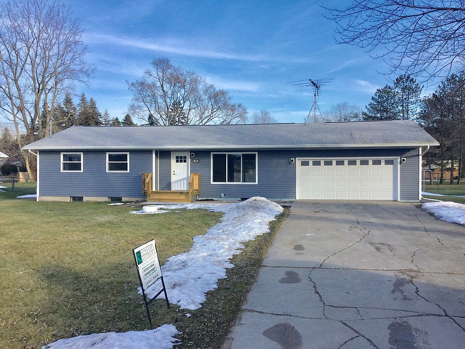 Let's start your New Year out right with a new home!  You'll love the newly remodeled ranch just completed with a brand new kitchen and open floor plan, full basement for storage, large yard partially fenced and an attached 2-1/2 car garage.  City water and city sewer ready to go with all assessments paid!  New enhancements include a stylish kitchen with quartz countertops and separate island, glass-accent tile backsplash and stainless appliances (buyer can choose gas/electric stove with purchase).  The home has all new floor coverings including laminate hardwood, carpeting and ceramic tile in both bathrooms.  Exterior is carefree with easy to maintain vinyl siding, new windows, front porch and all doors.  The inside has new interior doors, painting, lighting and updated baths so you can just move in and decorate.  The master bedroom has 2 closets for storage and a half bath for convenience.  The location is close to downtown, rail trail and parks so call today - it won't last long!  