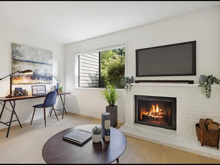 Third bedroom has an operable wood-burning fireplace / being used as home office