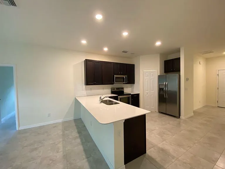Kitchen with pantry door.