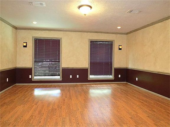 Flex room with chair rail and hardwoods could be a study, game room, formal living or dining...you d