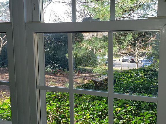 View one of the bedroom windows overlooking beautiful yard...