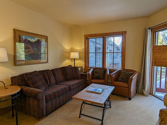 Sofa sleeper has a queen pull out facing the balcony, fireplace and smart TV.