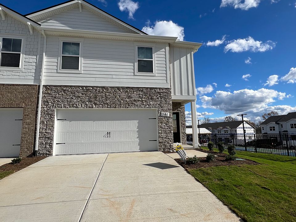 End unit, 2 car garage and driveway