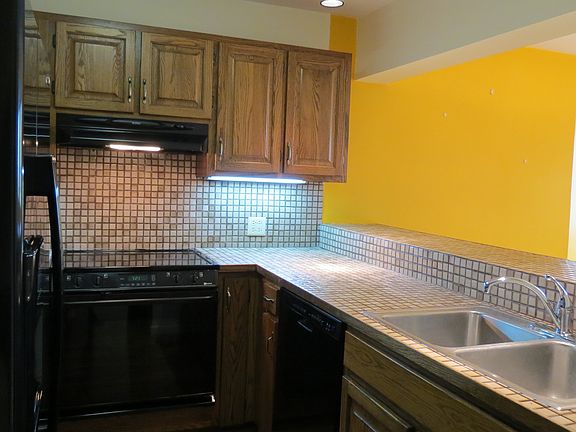 Kitchen shown before accent wall painted