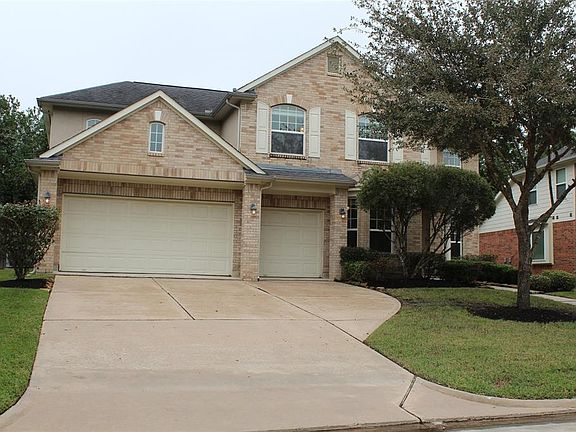 Three car attached garage with extra parking 3 to 2 car driveway parking spaces.
