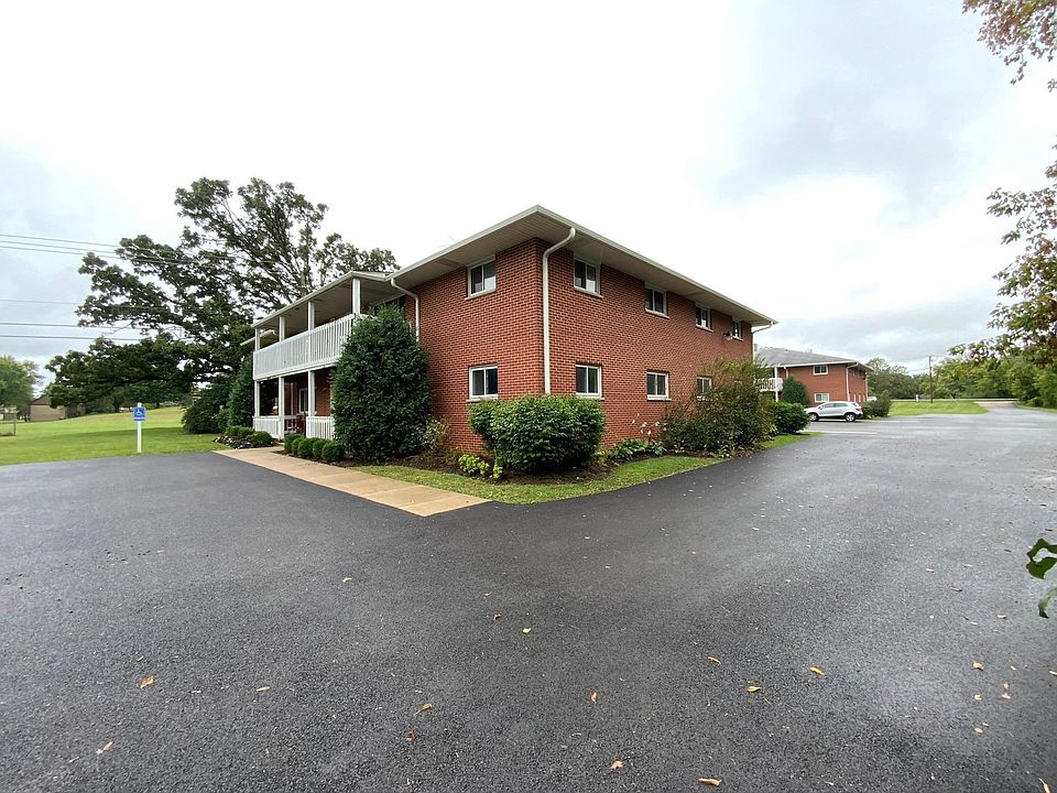 Exterior photo of 1904 building - Spacious property with the building are far away from Route 47 for a quiet environment. Lots of green space and parking!