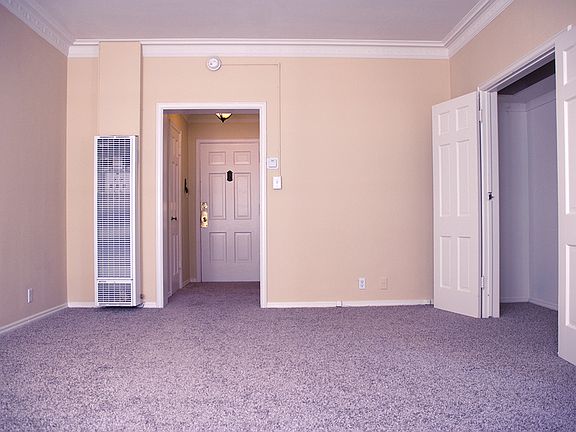 Main Room looking toward the entryway, with a storage closet on the right.