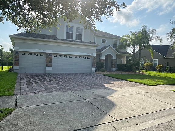 With 3 car driveway & garage