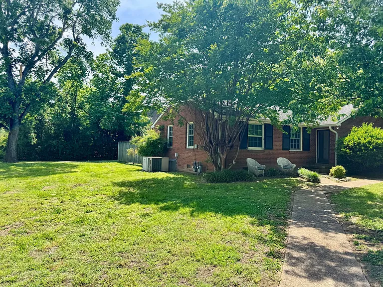 Large side yard and front walkway.