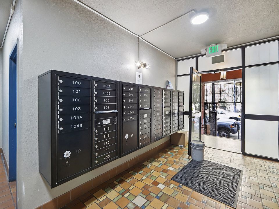 Apartment foyer with stylish decor and mailboxes