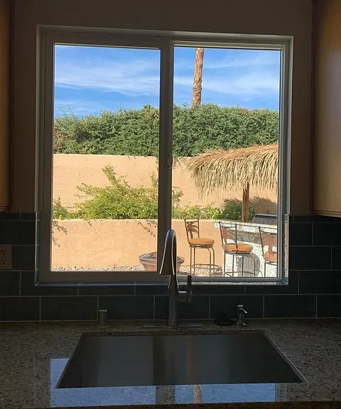 View from kitchen window - see new stainless sink.