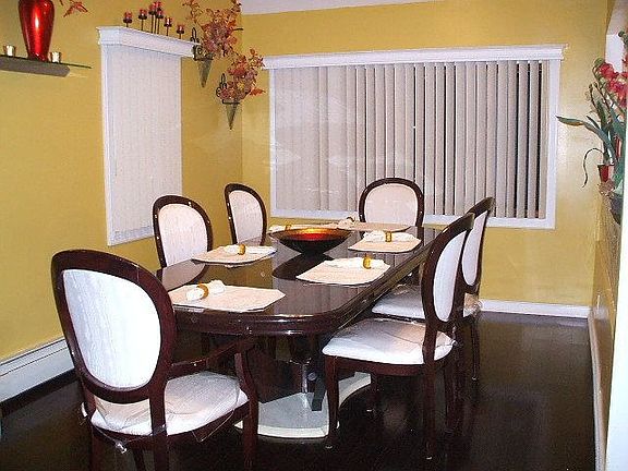 Formal Dining Roon with New Cherry Flooring and Custom Valances
