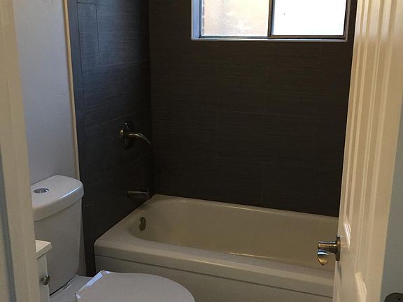 Bathroom is fully remodeled with modern finishes and lightin