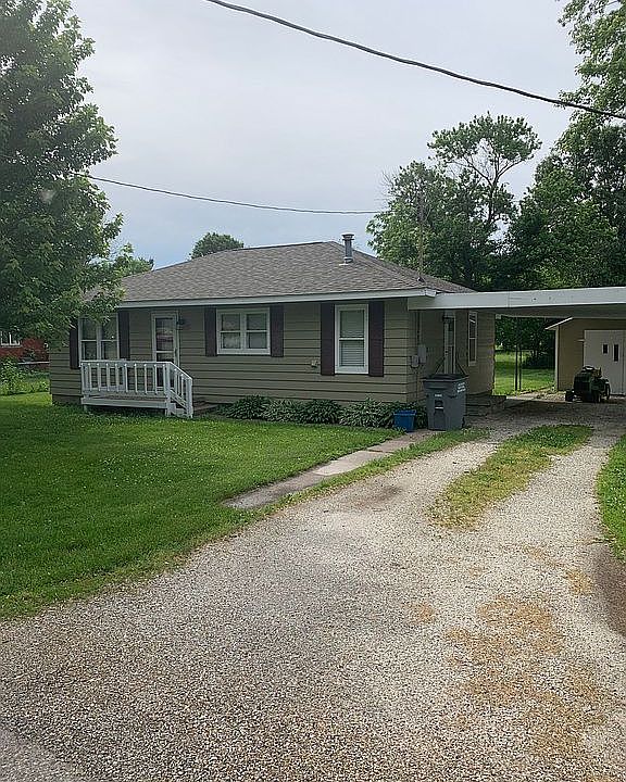 Front of house with carport 