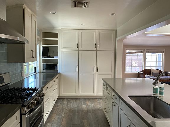 Three large floor to ceiling pantry with many pull out drawers. Microwave and tv included. I love this kitchen so much.