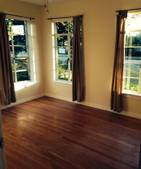 Old picture of front bedroom with curtains