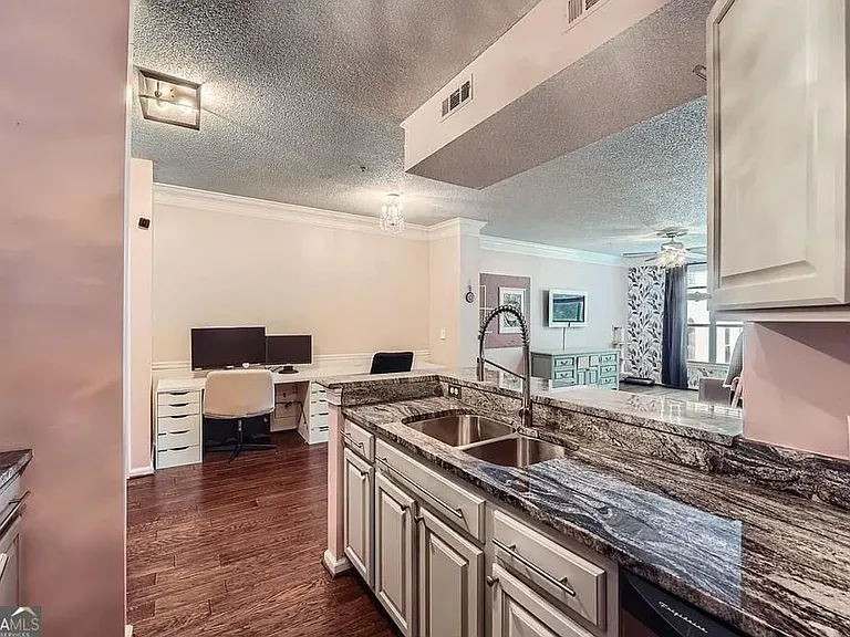 Great countertop food prep space with double sink and garbage disposal.